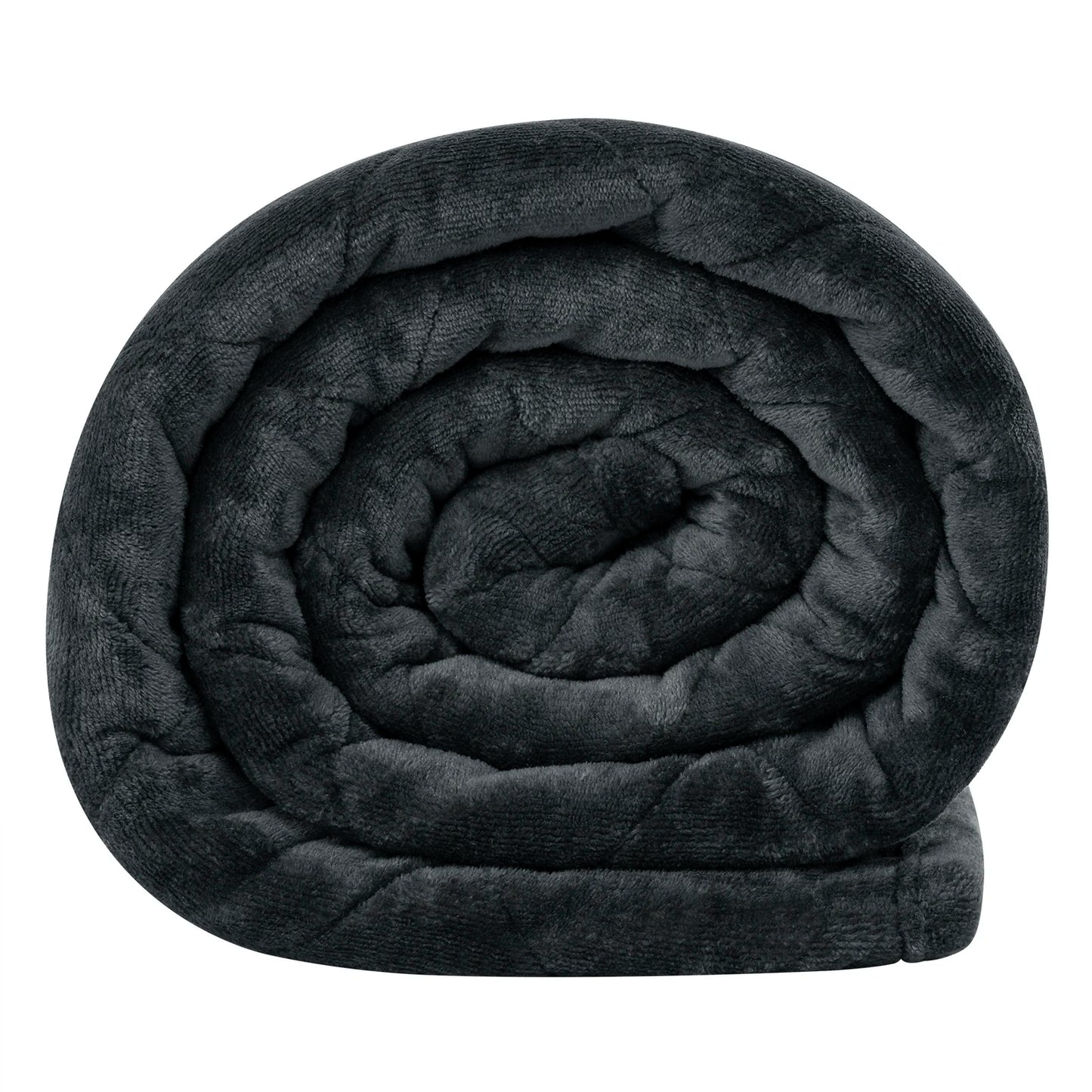 Weighted blanket draped over a bed with soft lighting, creating a cozy and calming atmosphere