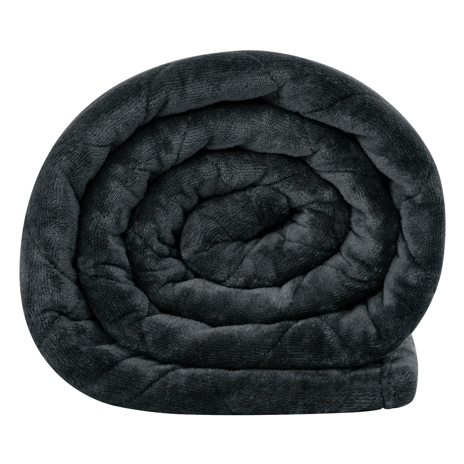 Weighted blanket draped over a bed with soft lighting, creating a cozy and calming atmosphere