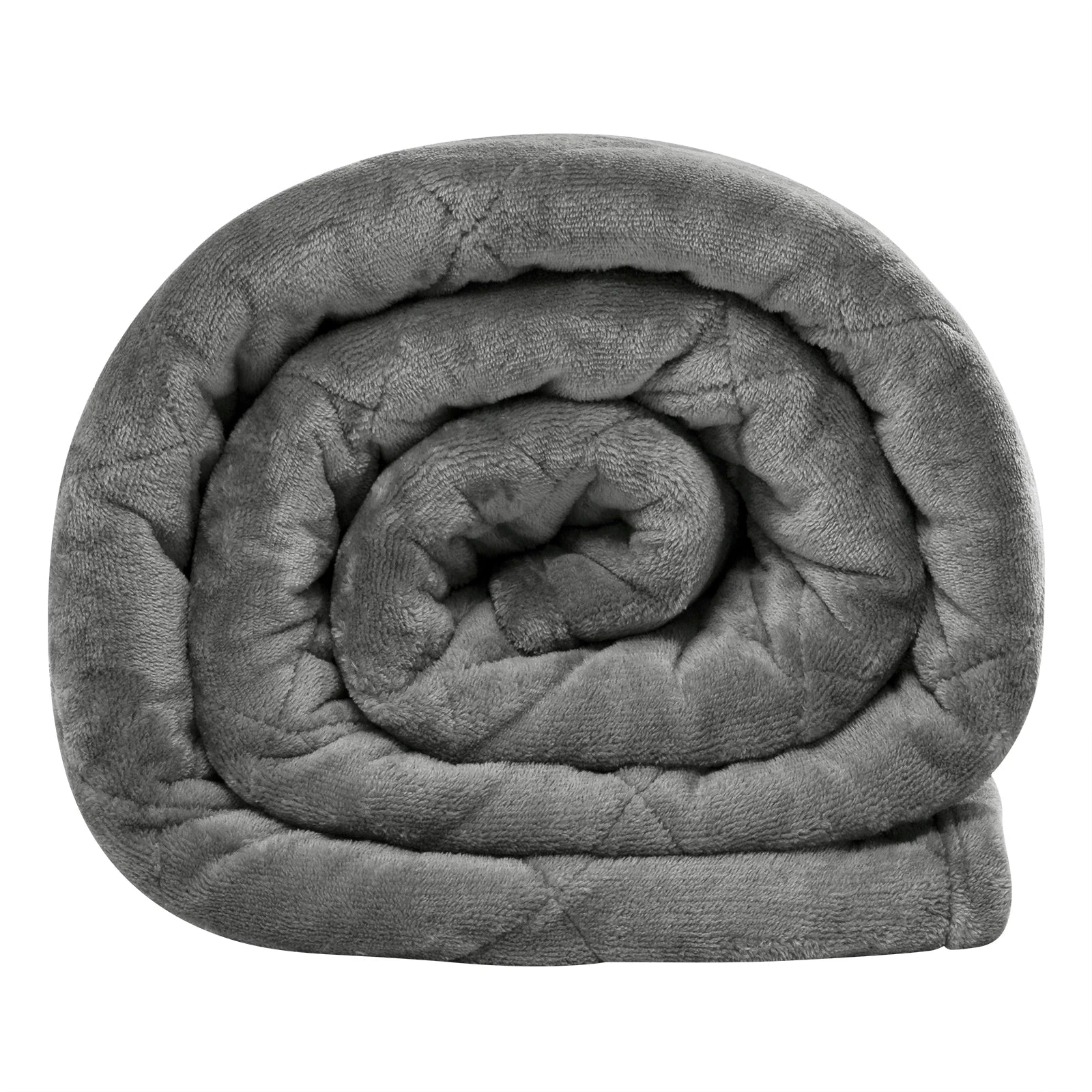 Weighted blanket draped over a bed with soft lighting, creating a cozy and calming atmosphere