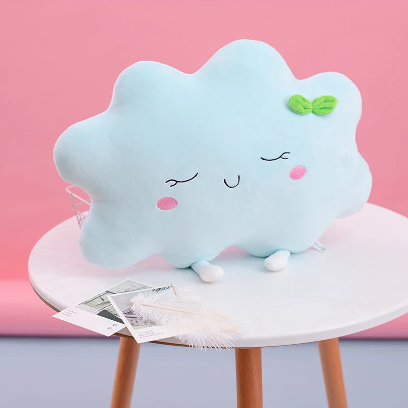 Plush flower and heart-shaped pillows arranged on a pastel bed setup