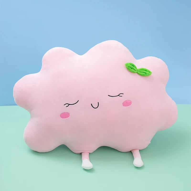 Plush flower and heart-shaped pillows arranged on a pastel bed setup