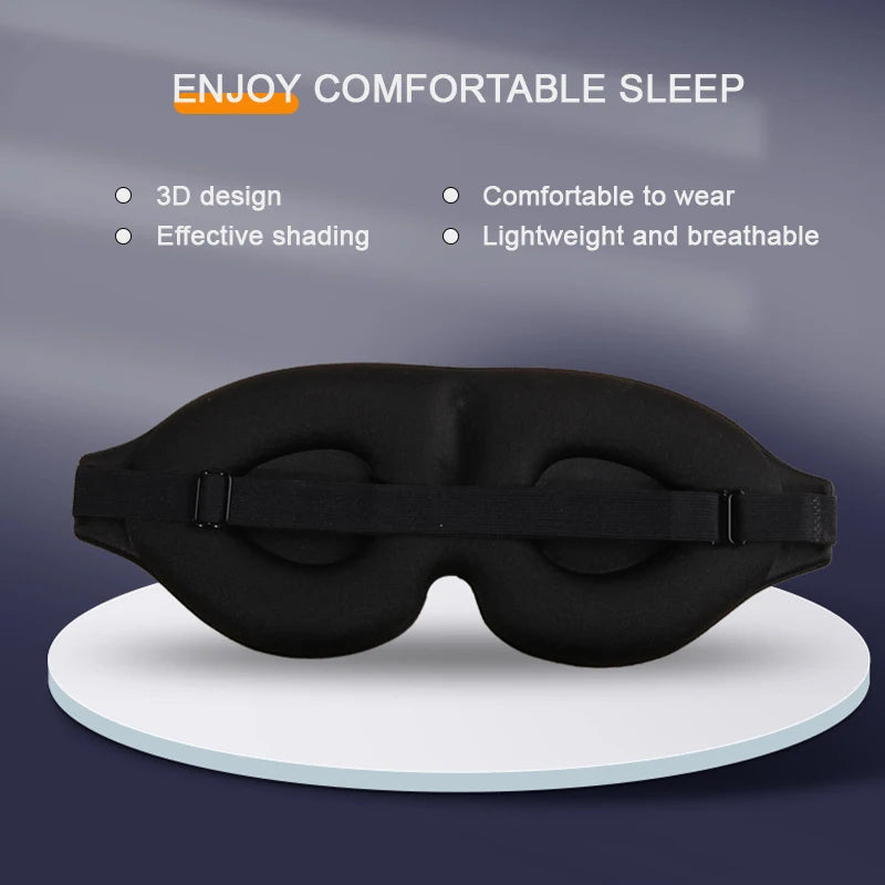 3D contoured sleep mask resting on a pillow, showing raised eye cups and soft material