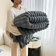 Ultra soft velvet blanket folded on a bed, showcasing thick plush texture and cozy feel