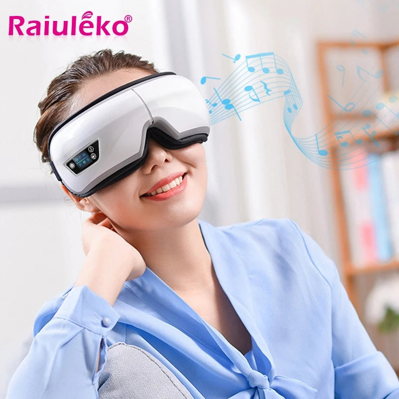 Smart eye massager with built-in controls resting on a table, showing soft lining and adjustable strap