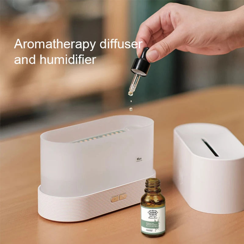LED flame diffuser releasing mist with a warm, flickering light on a wooden surface