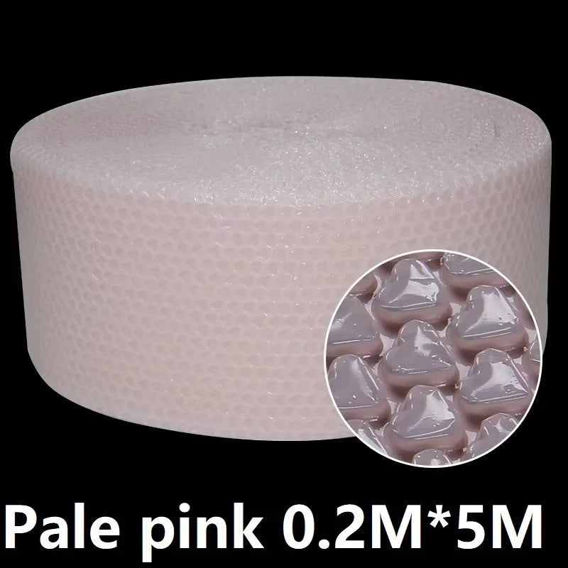 Hands popping bubble paper roll laid out on a desk in a relaxed workspace