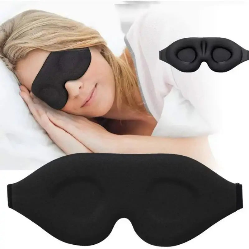 3D contoured sleep mask resting on a pillow, showing raised eye cups and soft material