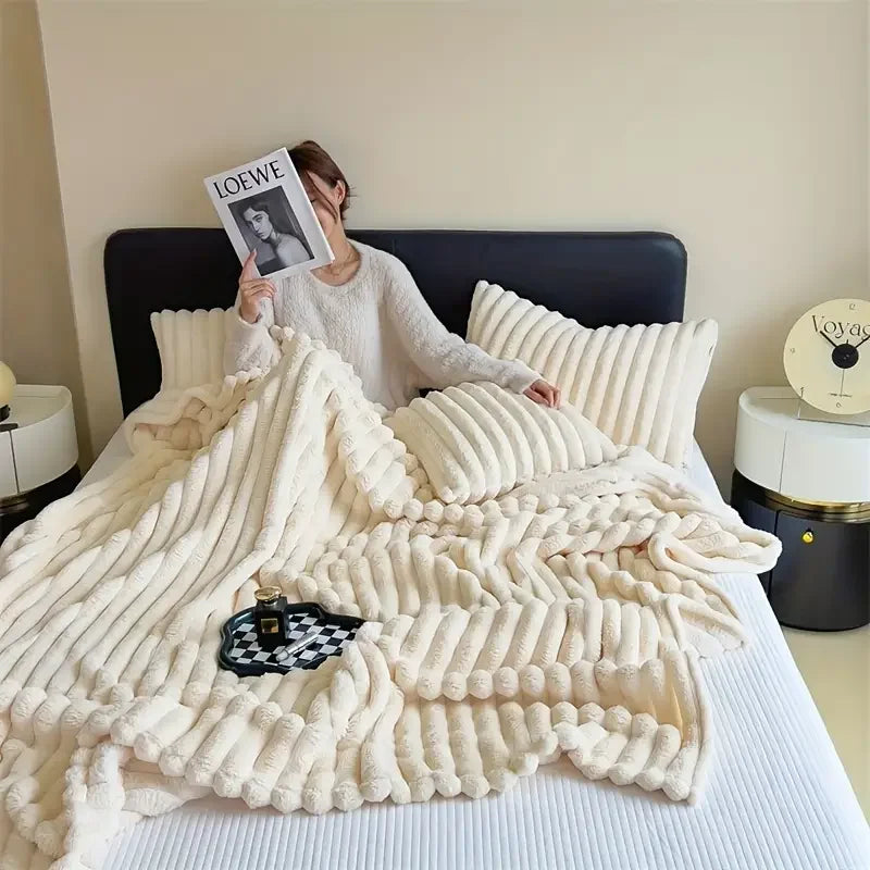 Ultra soft velvet blanket folded on a bed, showcasing thick plush texture and cozy feel