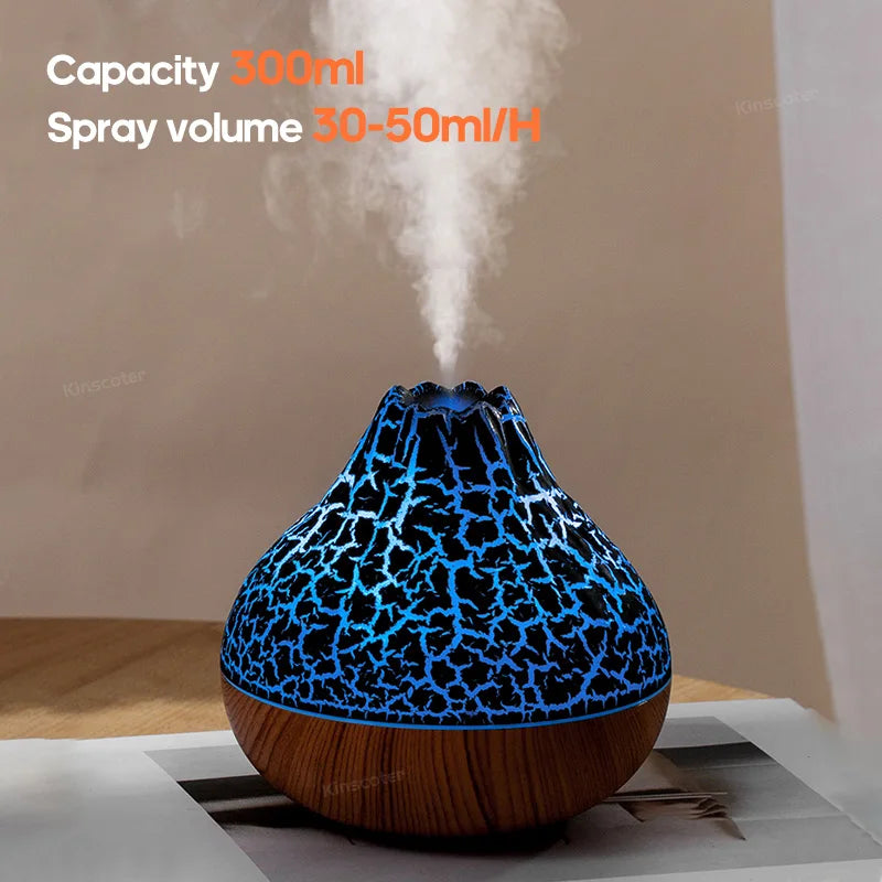 Volcano diffuser with glowing lava-like light and mist on a tabletop