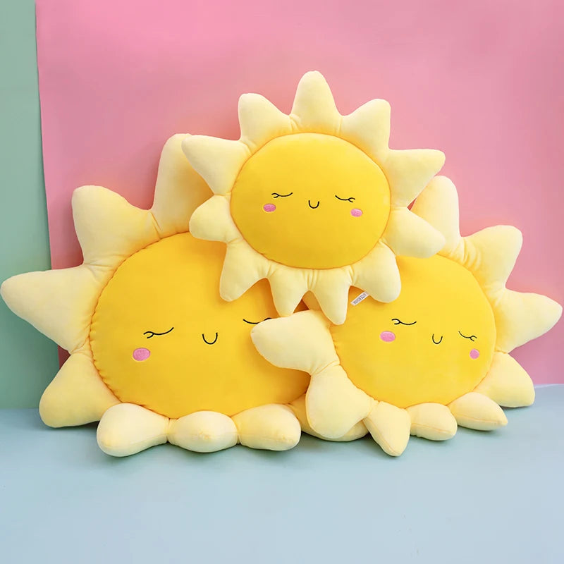 Plush flower and heart-shaped pillows arranged on a pastel bed setup
