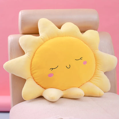 Plush flower and heart-shaped pillows arranged on a pastel bed setup
