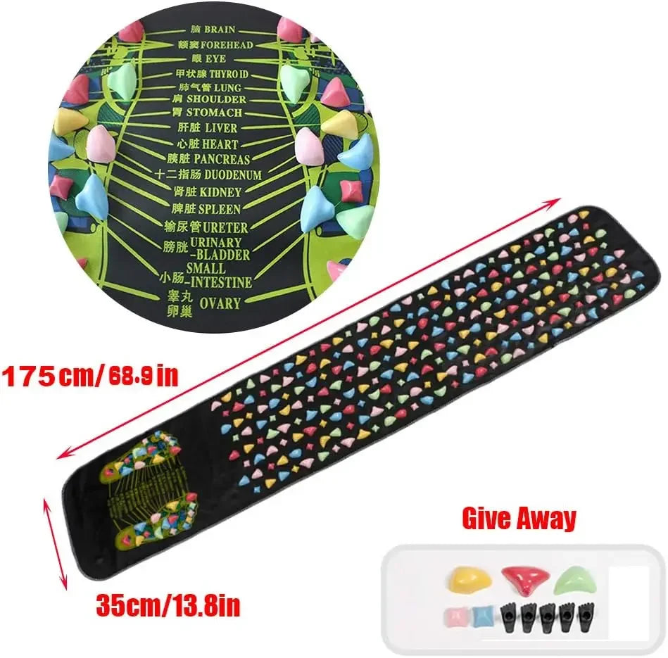 Foot massage pad with acupressure points placed on the floor, with bare feet standing on it
