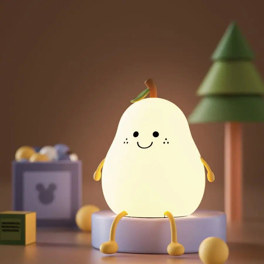 Pear-shaped silicone night light glowing softly on a bedside table in a child’s room
