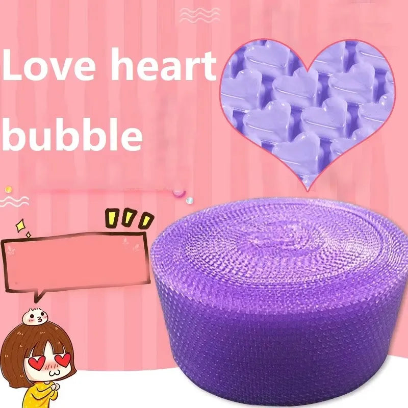 Hands popping bubble paper roll laid out on a desk in a relaxed workspace
