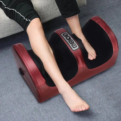 Electric Shiatsu foot massager with heat in use under a desk, showing feet inserted and lights on
