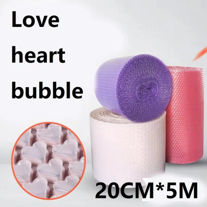 Hands popping bubble paper roll laid out on a desk in a relaxed workspace
