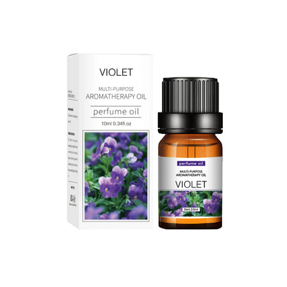 Set of flower and fruit essential oils in 10ml bottles arranged next to diffuser
