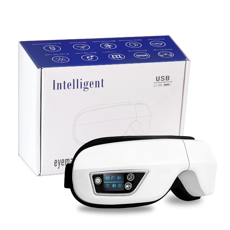 Smart eye massager with built-in controls resting on a table, showing soft lining and adjustable strap
